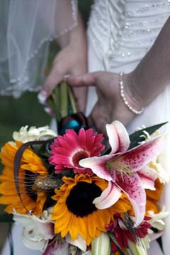 Sunflower, pink Gerbera Daisy, Stargazer Lily, and Wheat bridal bouquet // Design: Jessica Ormond Events. Lubbock Texas boutique wedding florist.