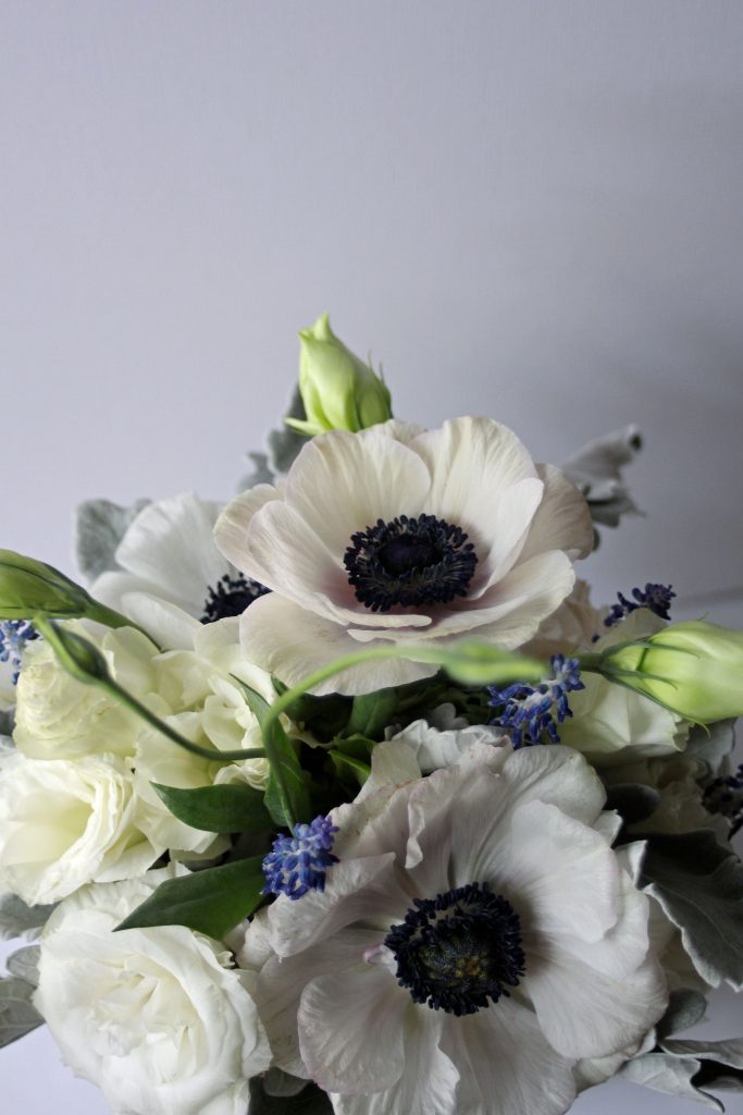 Anemone toss bouquet for Lubbock wedding at the Texas Tech Club. Designed by Jessica Ormond Events.