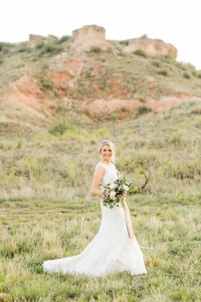 Elegant bride in canyon photographed by Texas photographer Allee J. Bouquet created by Jessica Ormond Events.